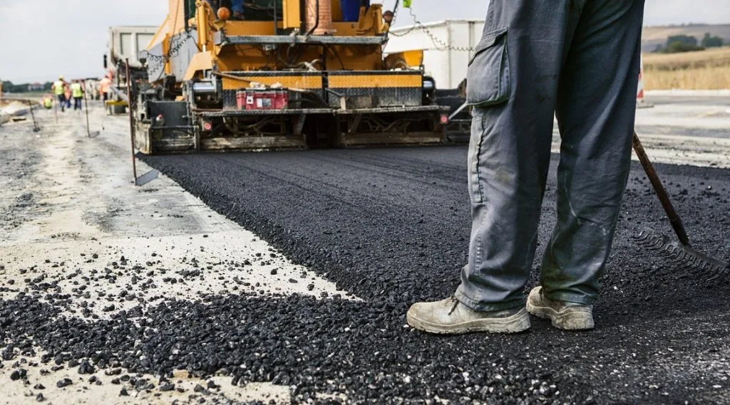 bigstock Worker operating asphalt paver 50201894 1024x569 1
